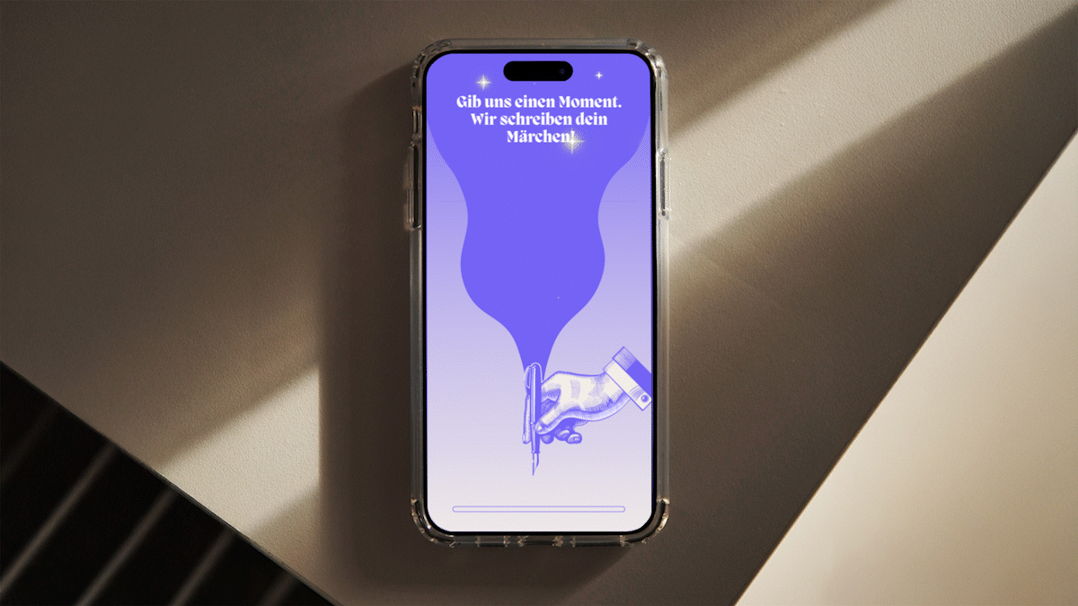 Mobile Phone on table. You see the loading screen of the app 